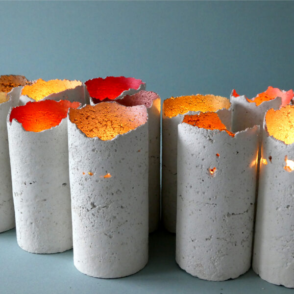 A handcrafted and lightweight white concrete candleholder. Each candleholder is unique as it has been handmade. A Scandinavian decorative light painted inside with various metallic colours, with a minimalist look.